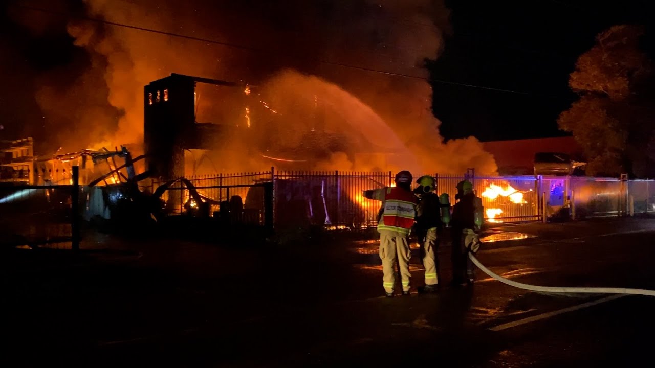 Firefighters battle major blaze in auto wreckers yard at Fairfield East NSW