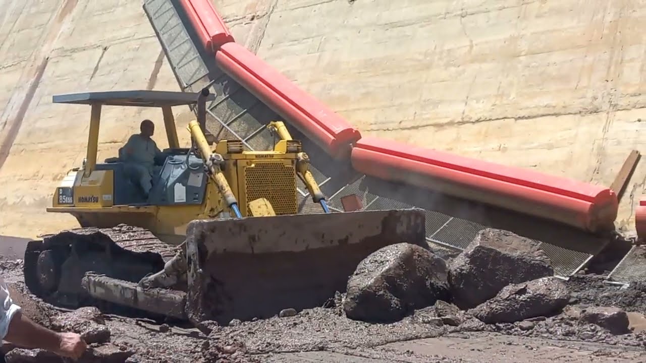 Dam flushing:Bulldozer Conquer Muddy Silt and Heavy Stones at the Dam Intake|dam sediments flushing
