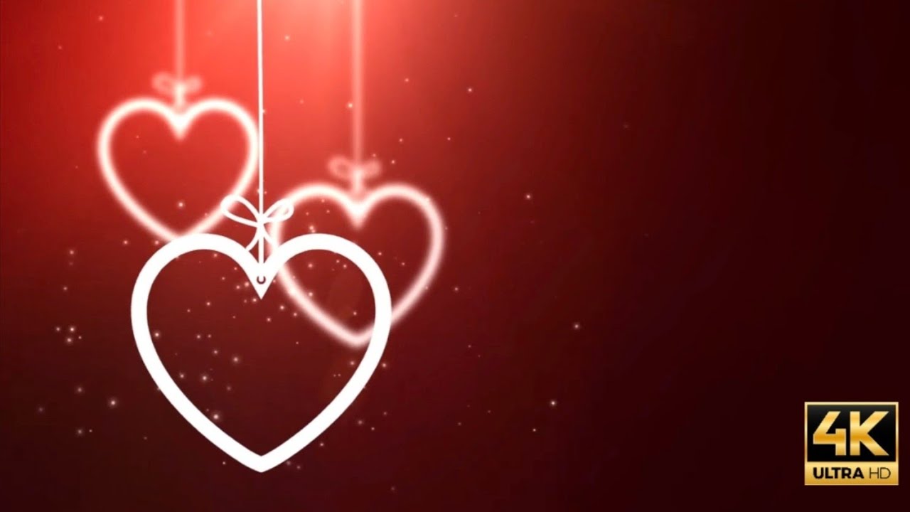 4k 1hr Romantic Valentine's day background loop red with hanging heartine ornaments 