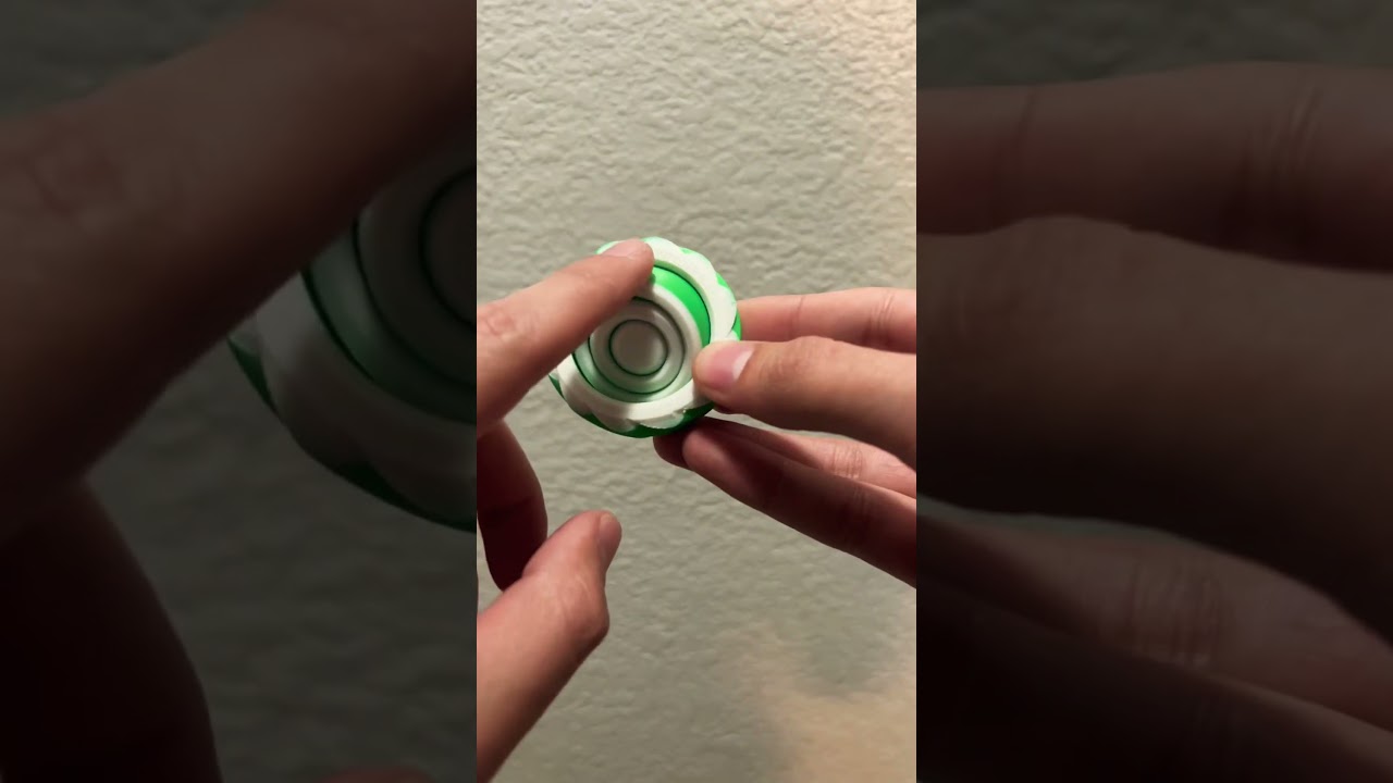 Satisfying 3D printed Gyro fidget spinner in Bambu Green and Jade White.