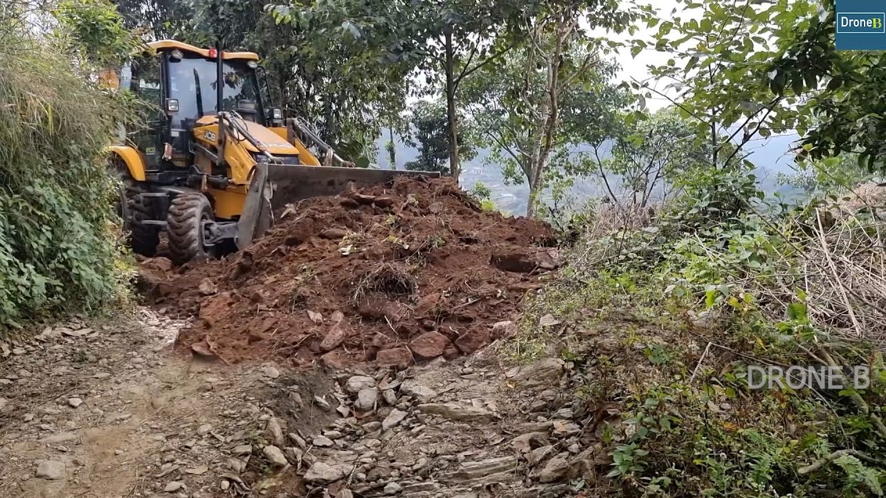 Very Narrow Mountain Road Resurfacing with JCB Backhoe