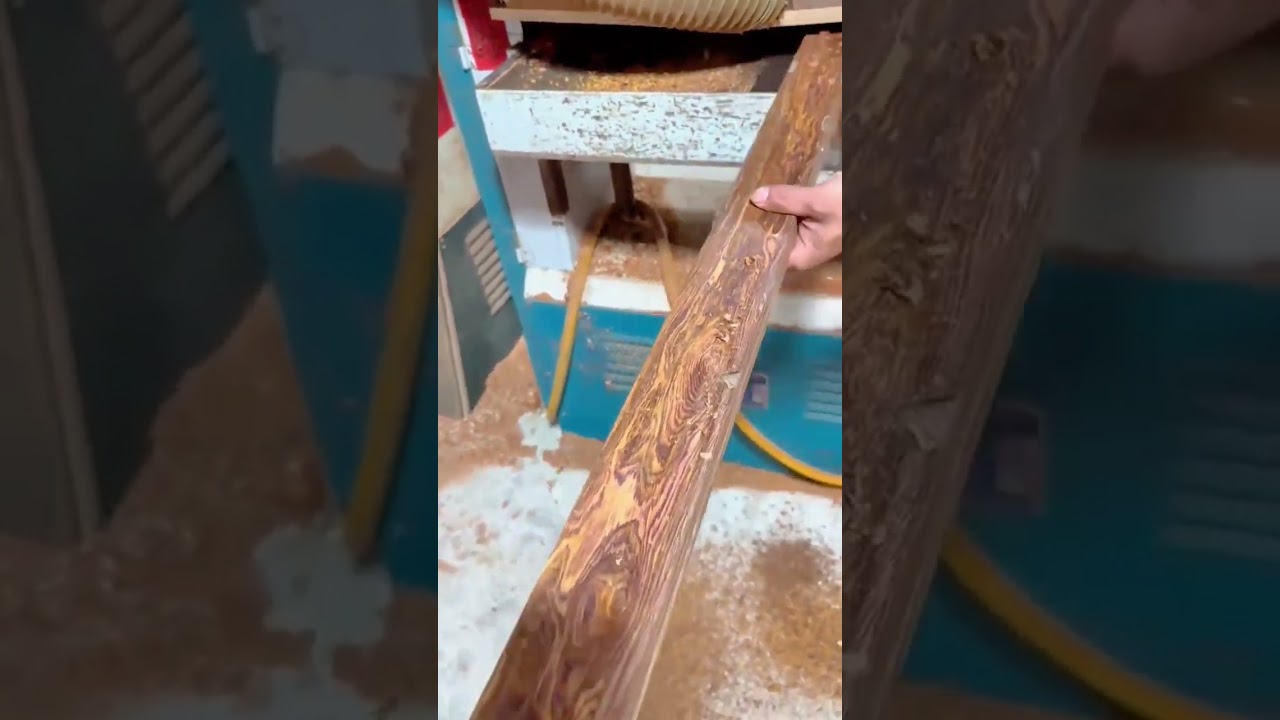 Sanding wooden planks smoothly using an automatic belt sander for polished surface finishing