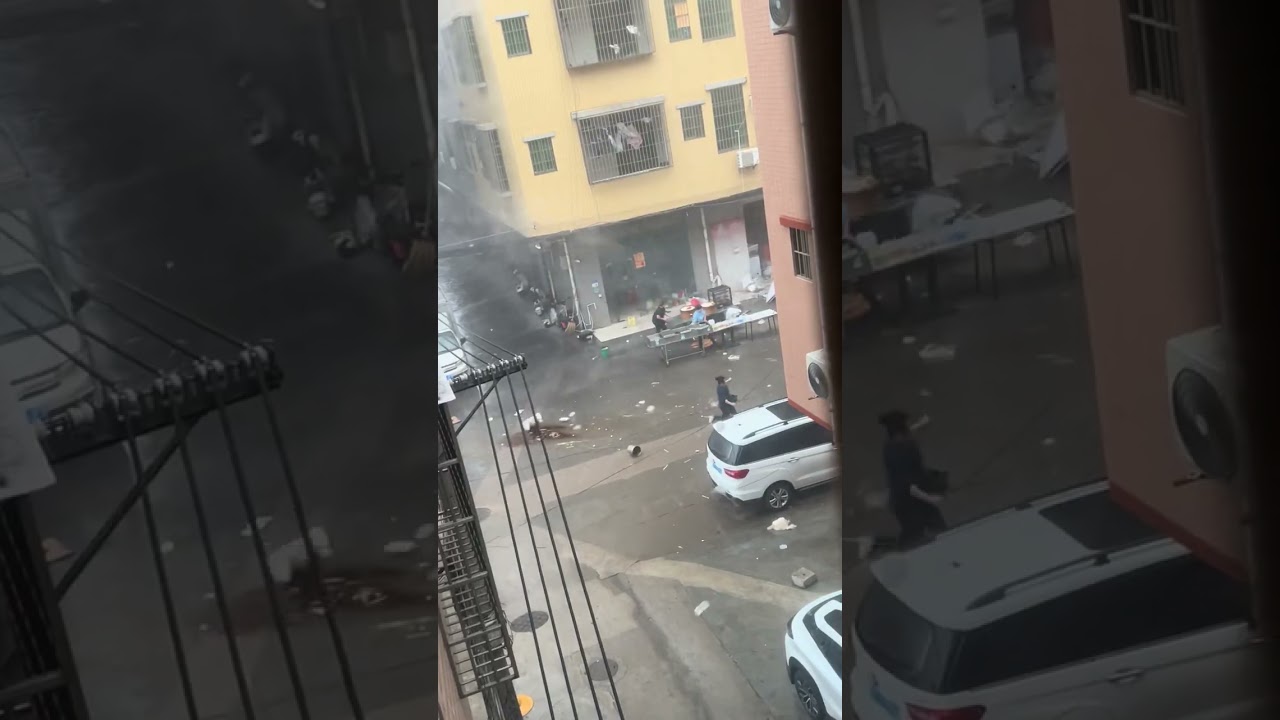 People chase runaway cart during strong winds and heavy rain in Guangdong, China