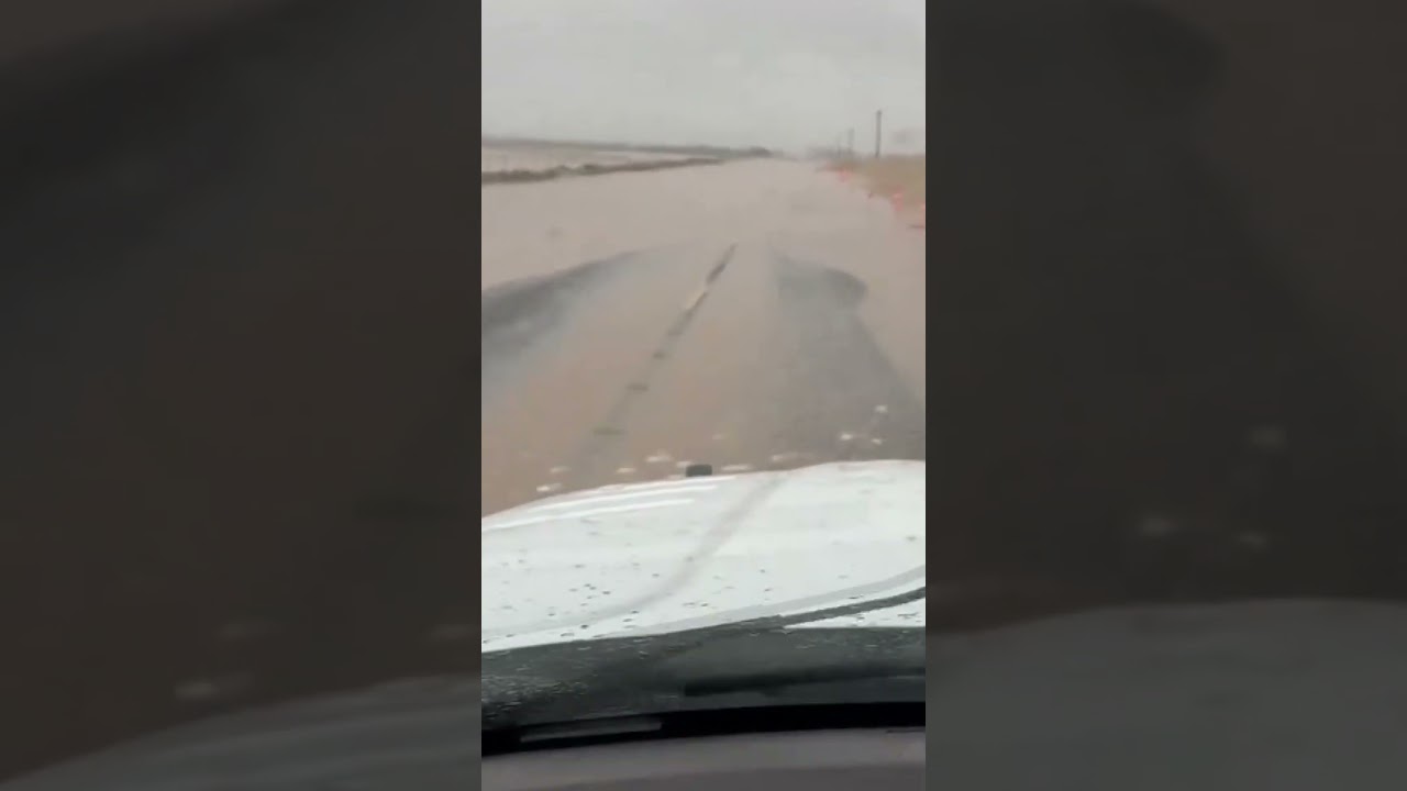 Driving through muddy floodwaters in Fluvanna, Texas
