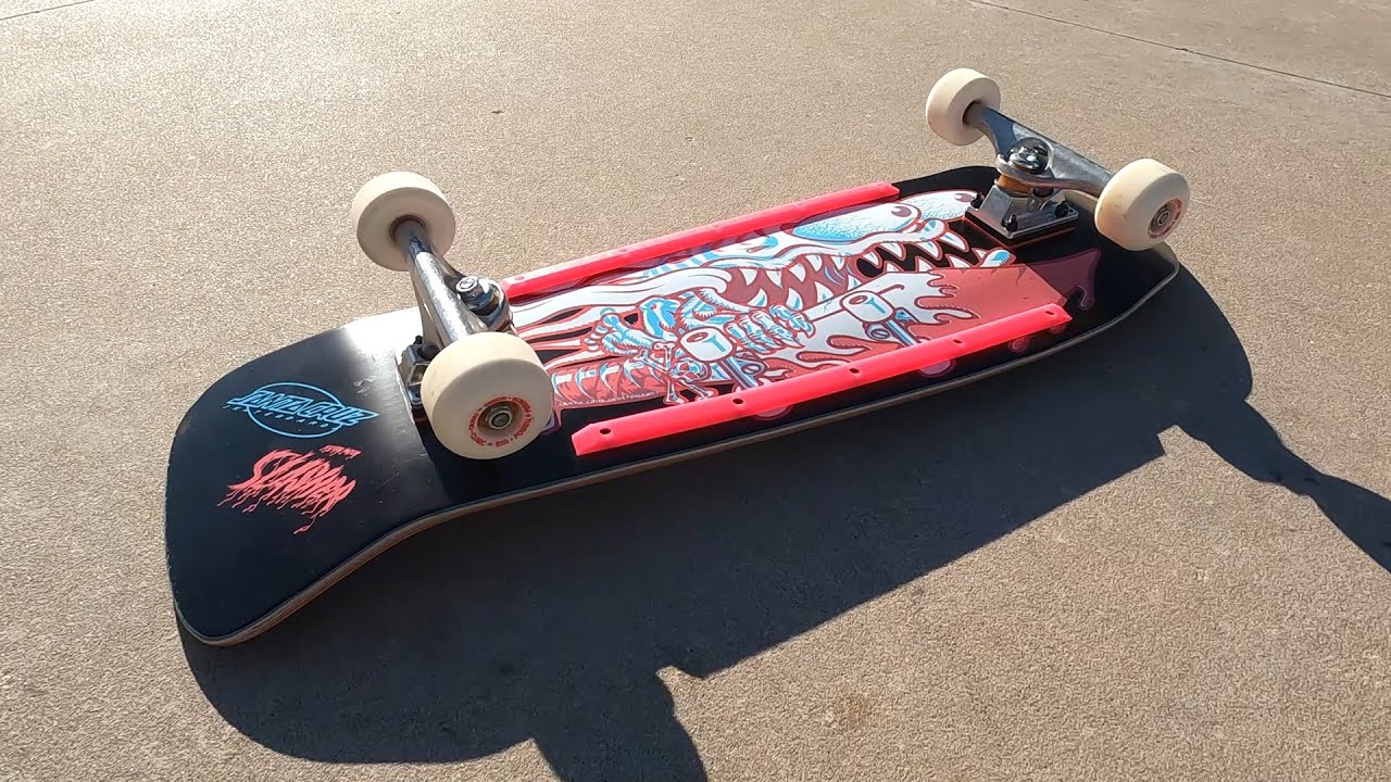 Riding a Santa Cruz Keith Meek Slasher Skateboard Deck