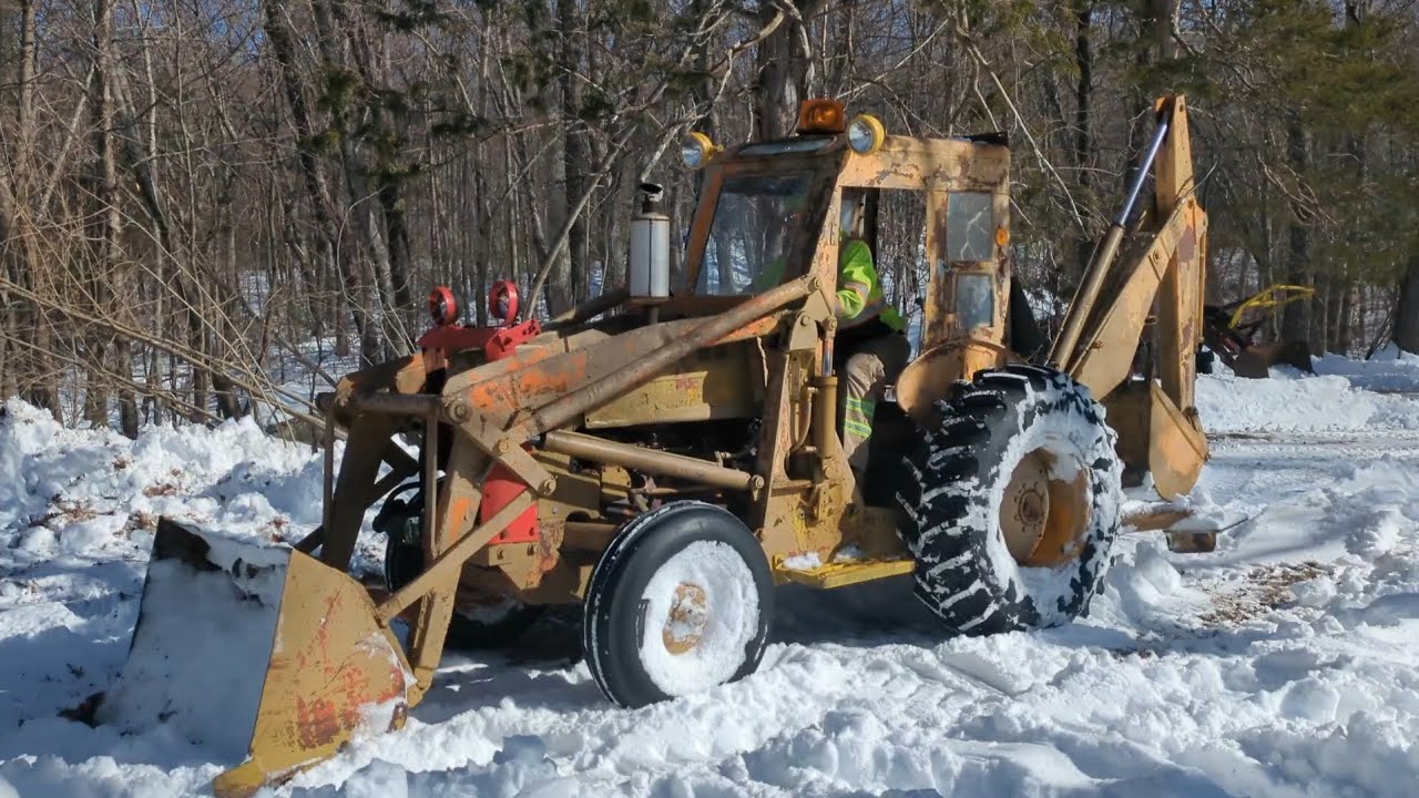 Moving snow with a 70 year old backhoe 