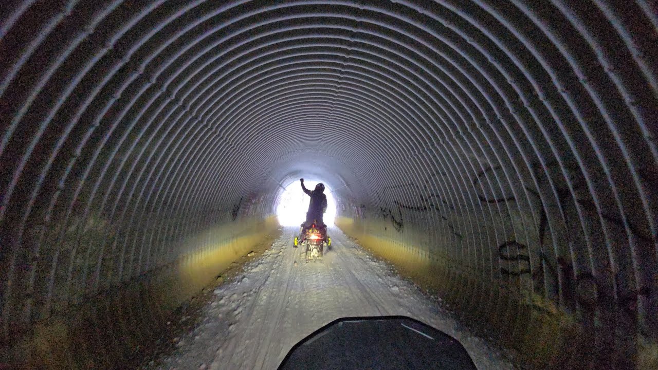 Snowmachine in AK in freezing rain, great views, tunnels, power lines, railroad tracks and Denali! 