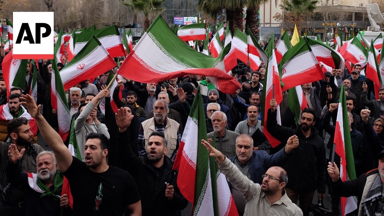 Supporters of Iran's government protest against Israel and US strikes