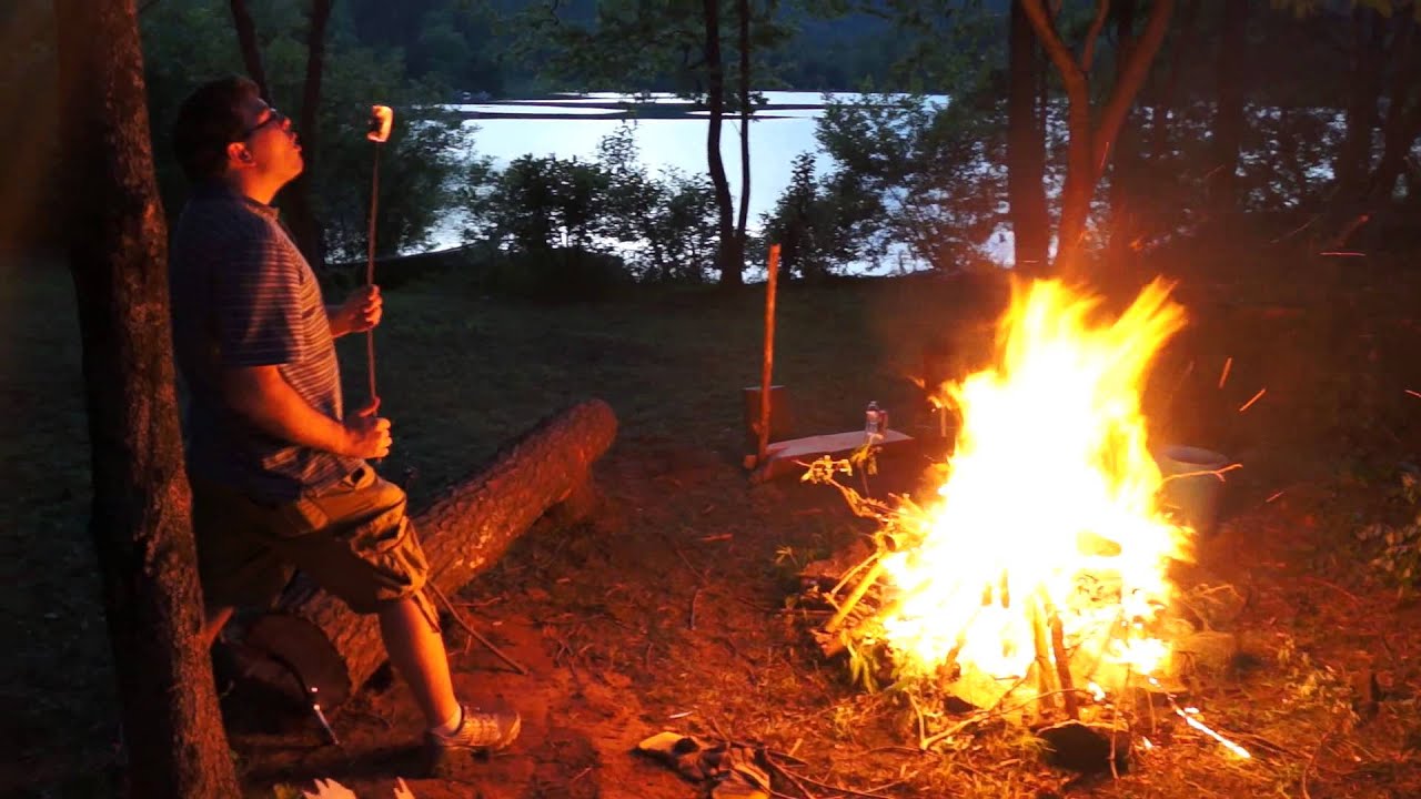 Nathan Roasting a Marshmallow in a Campfire That is Entirelly Too Big