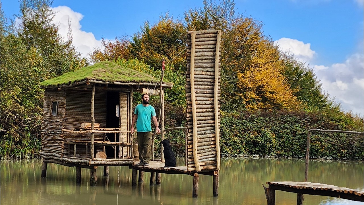 Bushcraft building and living with a dog above a lake in the wild!