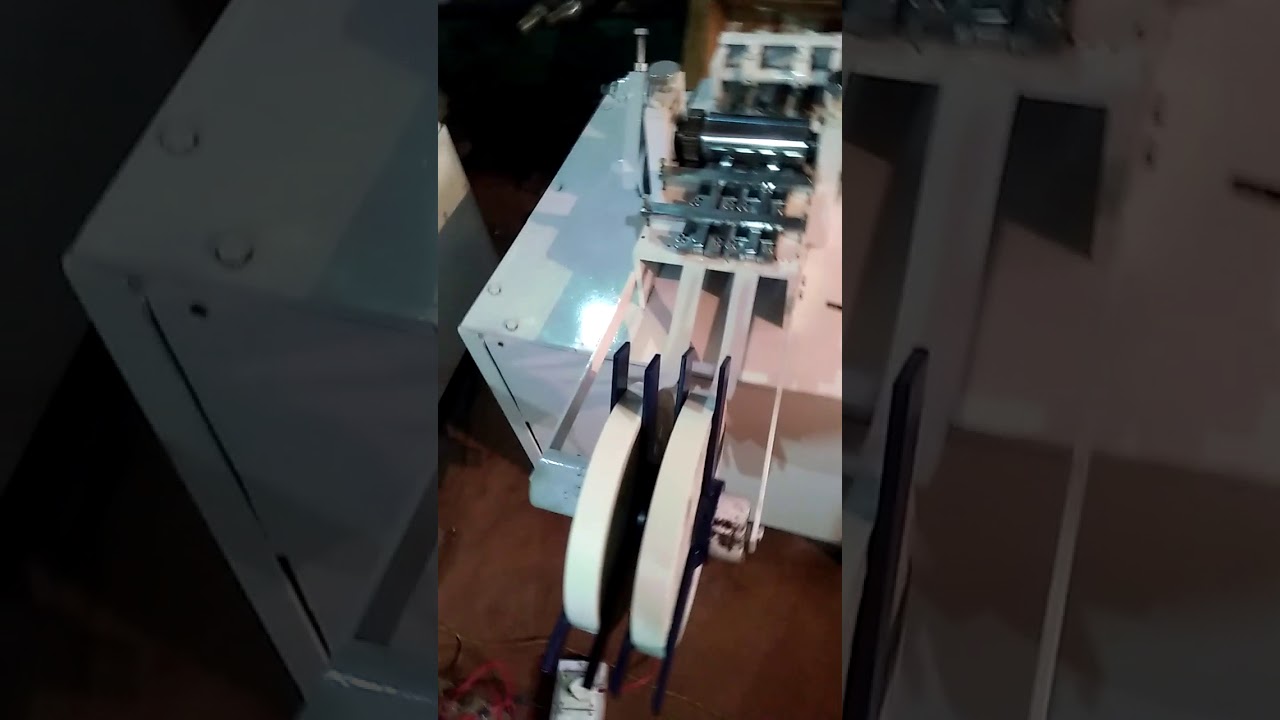 Paper folding and cutting machine