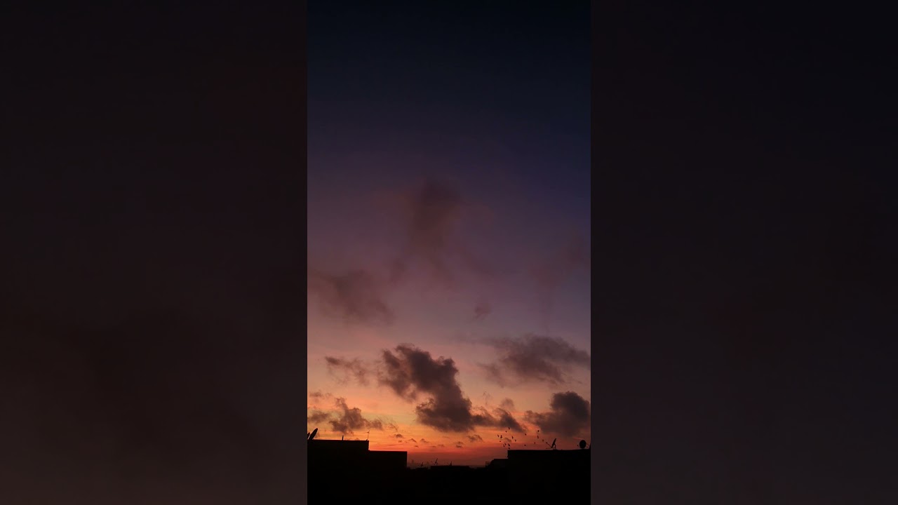 Time-lapse of moving clouds at sunset