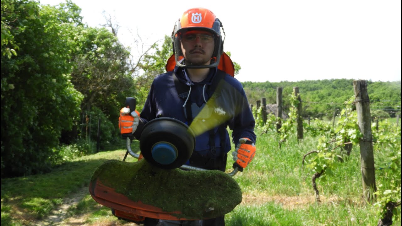 Husqvarna 545 RX Brushcutter, string trimming tall grass