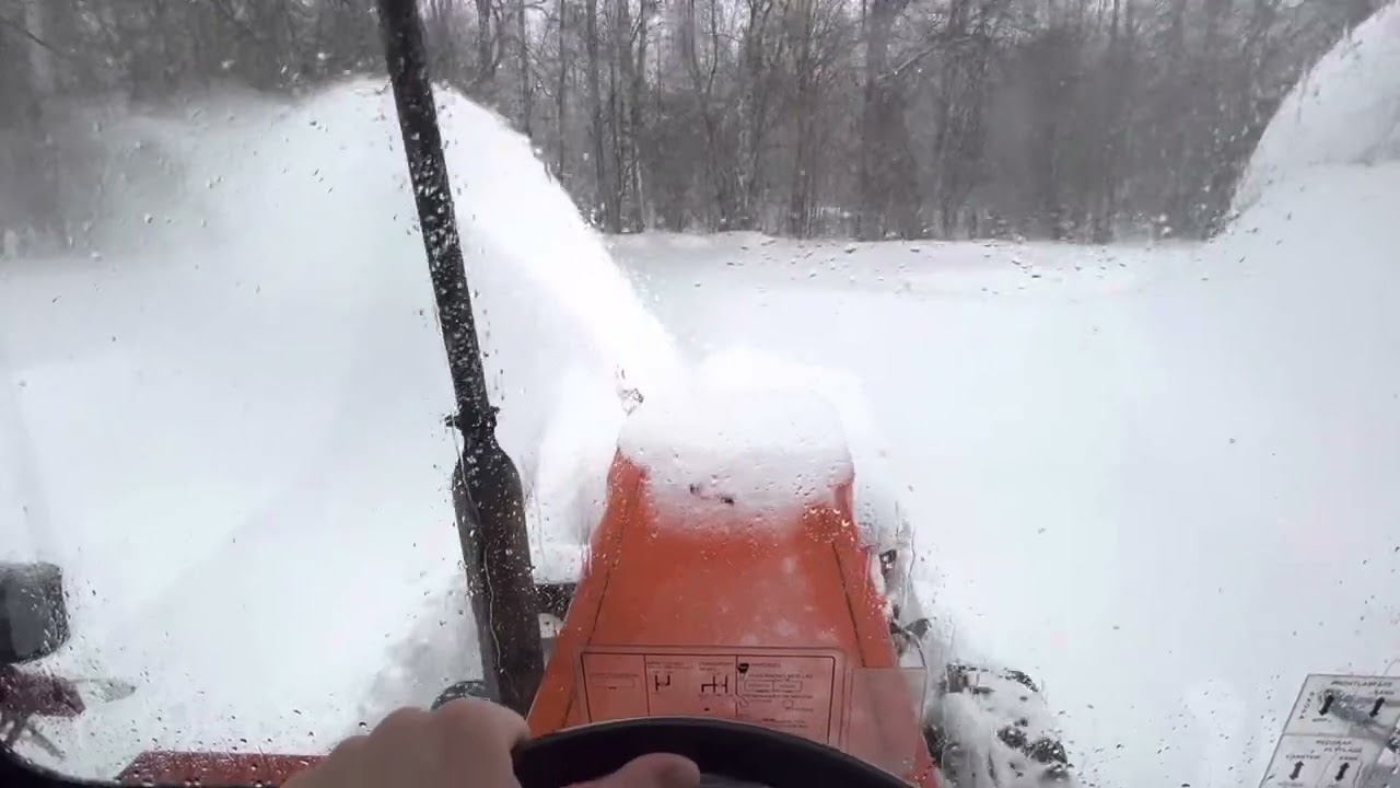 Kubota L245 clearing deep snow with Kova snowblower