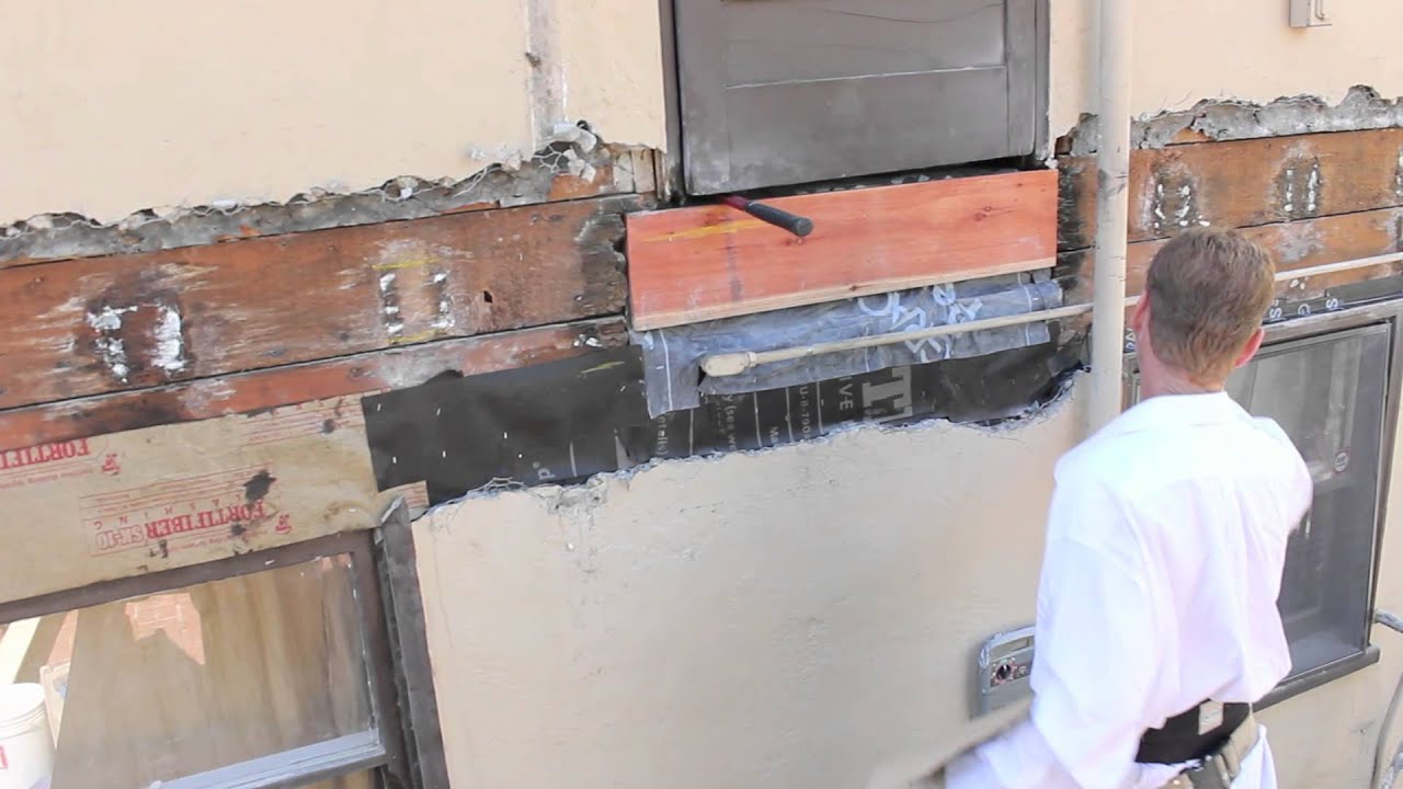 How to install a ledger board on a stucco wall.