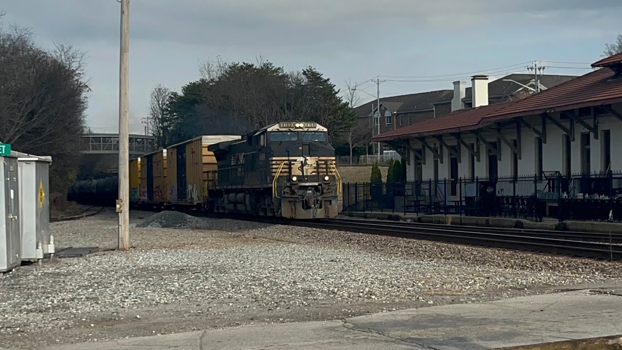 Norfolk Southern train with a DPU on the end of the train going through Vine Street ￼