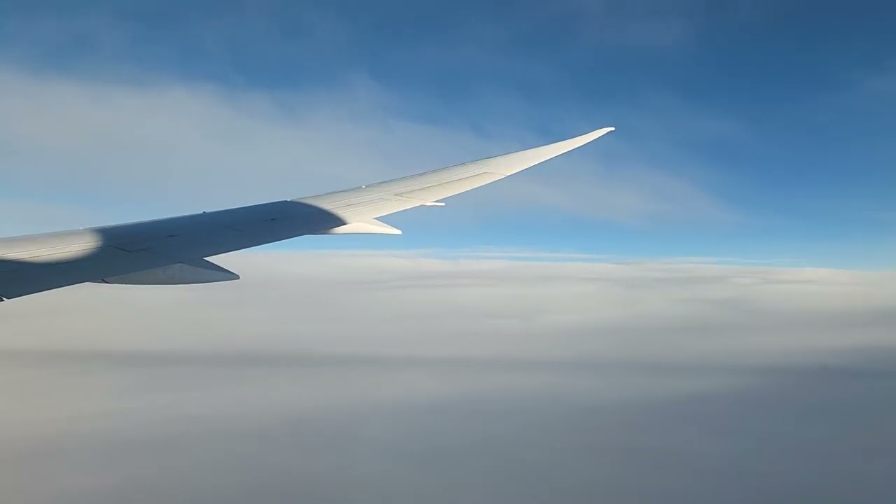 Flying Over the Pacific Ocean Crossing International Date Line on United Boeing 787 DreamLiner