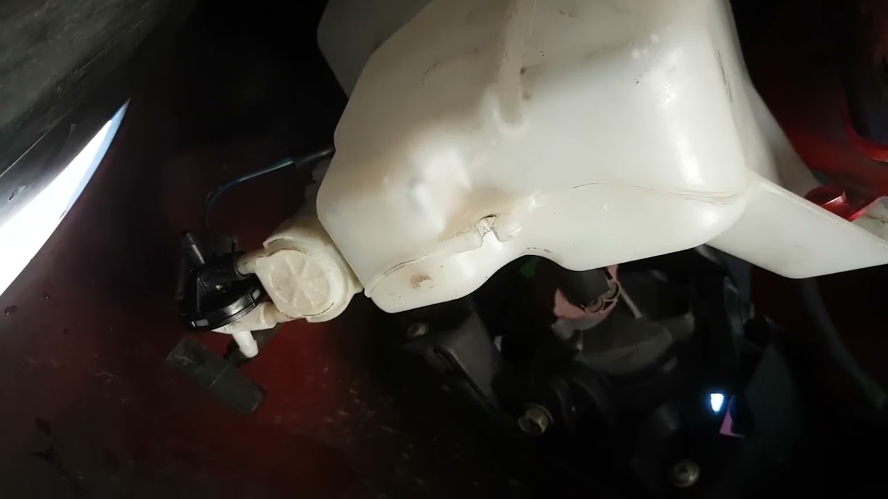 Repairing a Mazda2 DH 2007-2013 windscreen wiper water tank.  Jonathan C Nevill