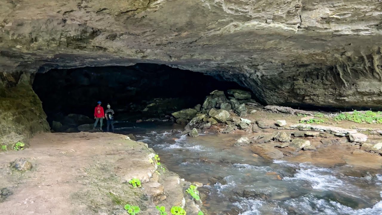 Raging River Pours Out Of Cave