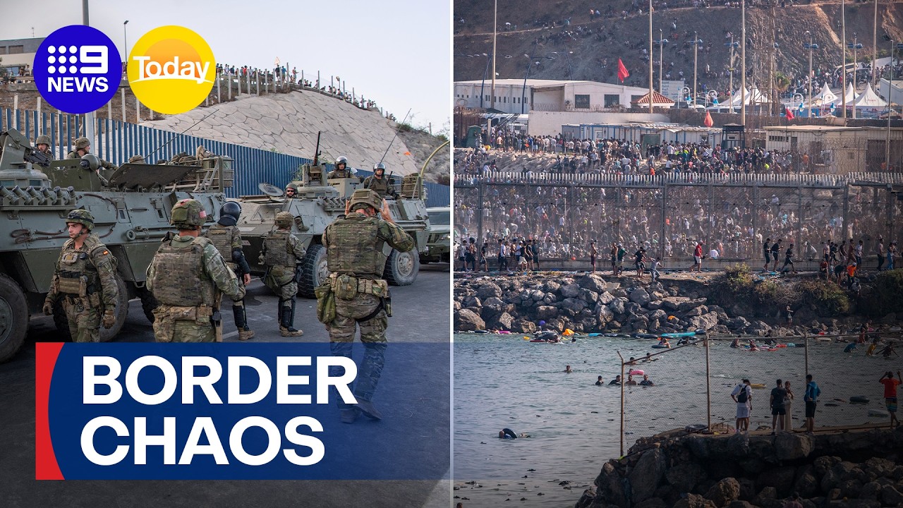 Thousands of migrants flood Spanish border control point | 9 News Australia