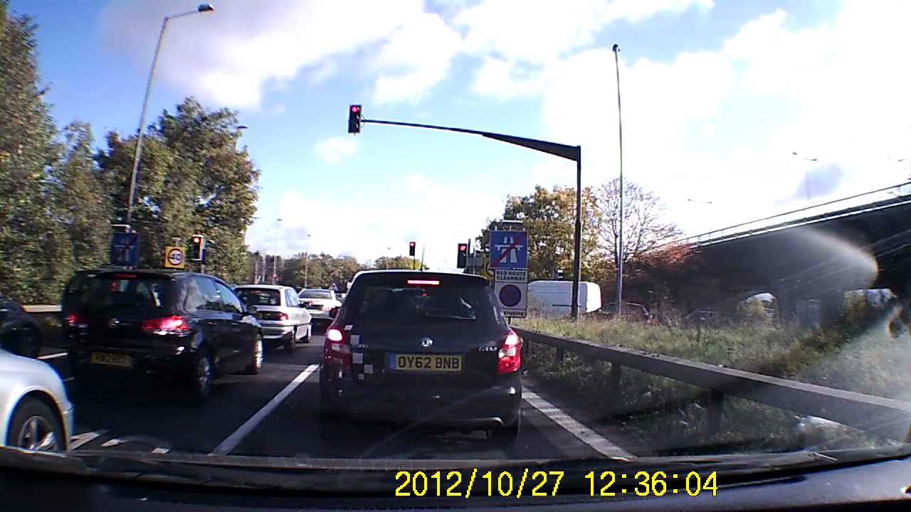 Guy In Black Car Races At High Speed Up Slip Road