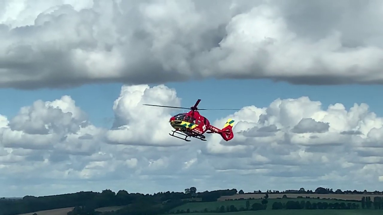 G-TVAL air ambulance helicopter landing with the Beckley Radio/TV Transmitter visible on the horizon