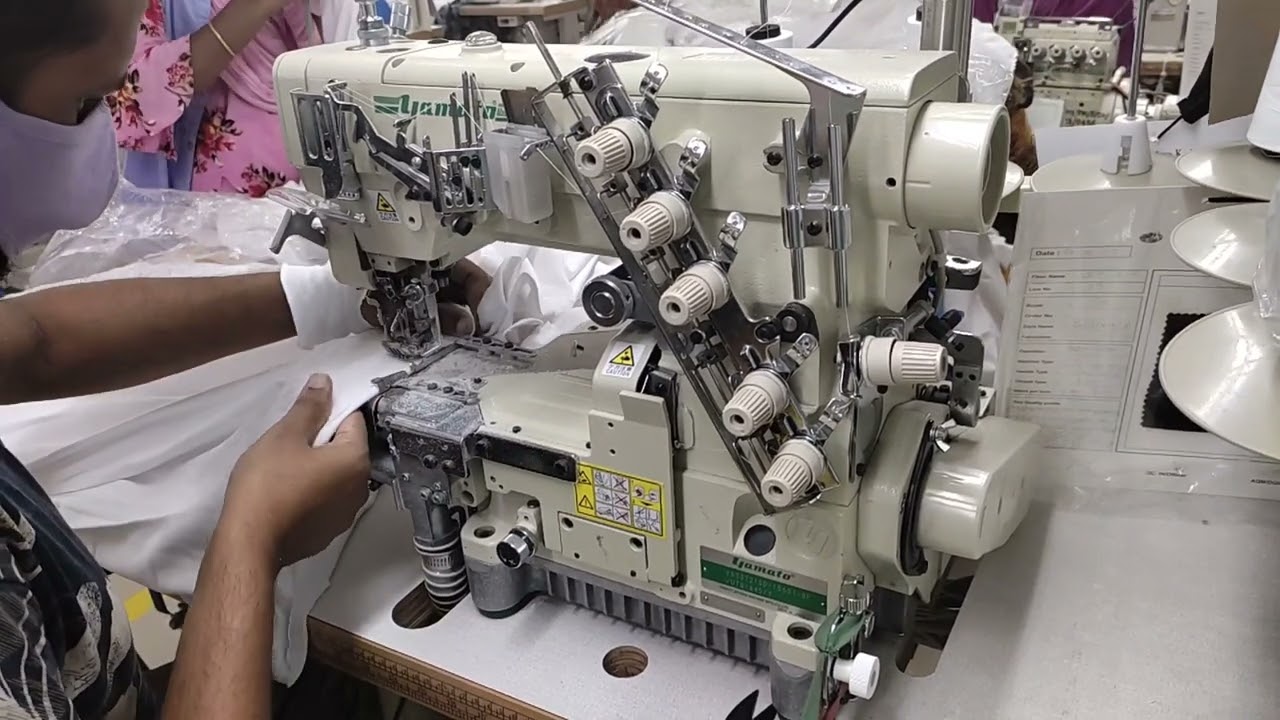 flatlock sewing machine. bottom hem of t shirt. industrial flat lock sewing machine.
