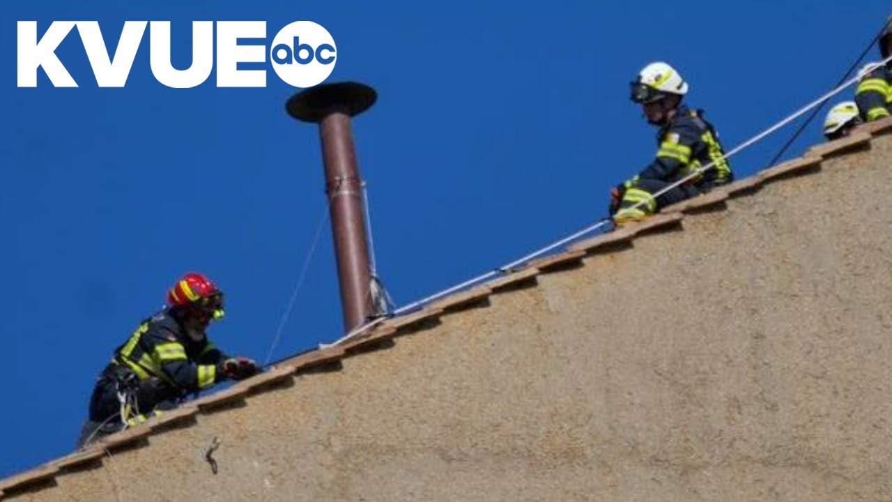 Vatican firefighters install chimney on the roof of the Sistine Chapel for the papal election