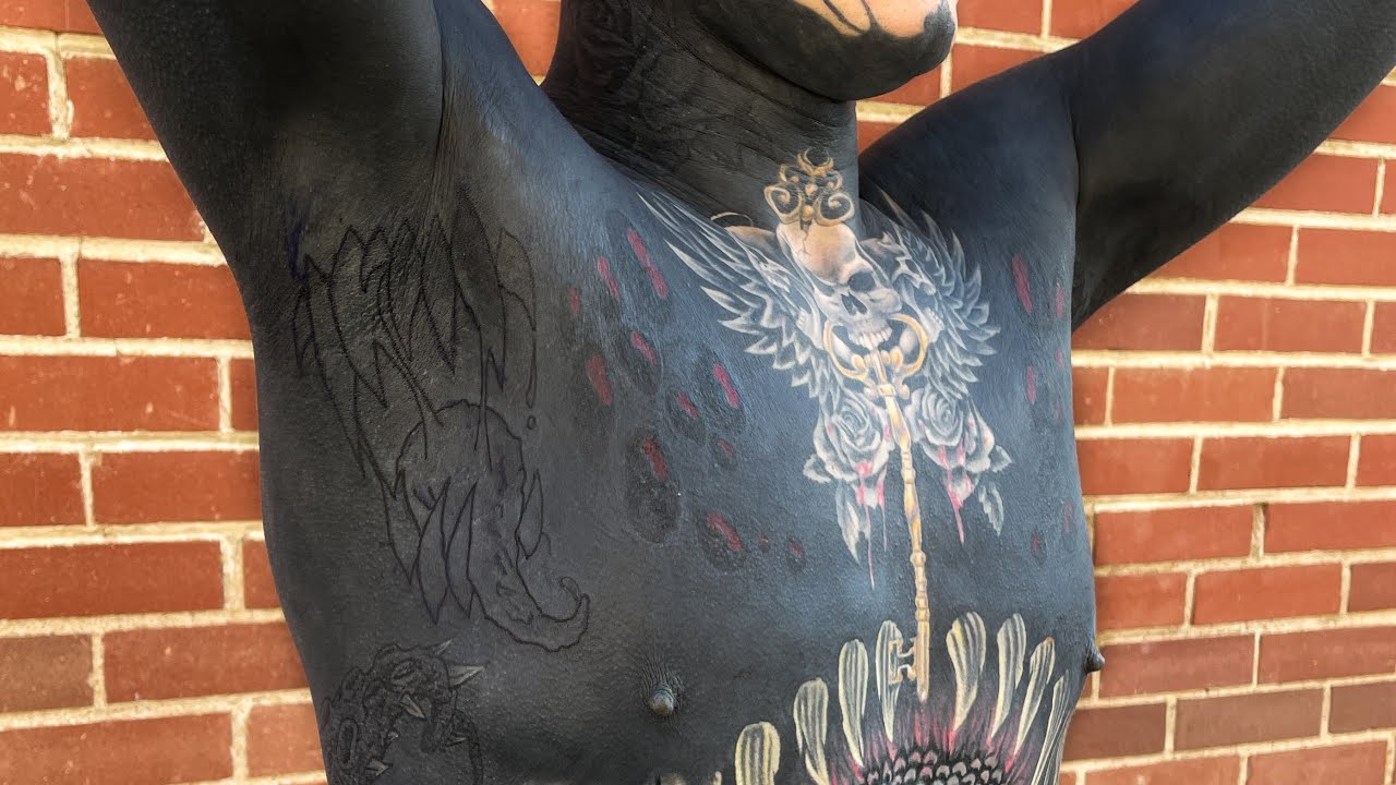 New armpit tattoos, and purple silver highlights.