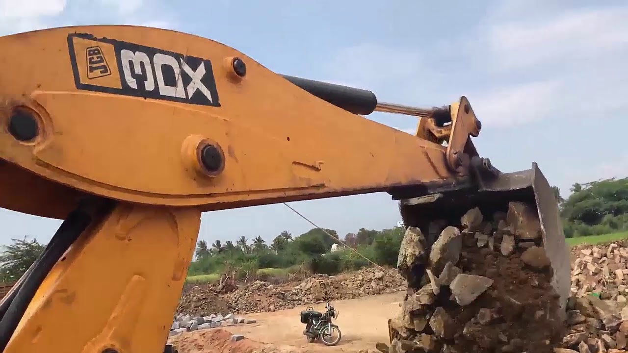 JCB 3DX Super Loading Stone into a Dump Truck
