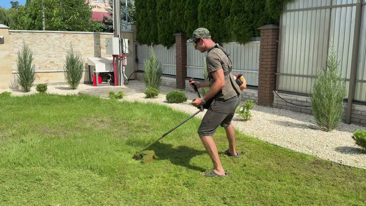 Professional lawn mowing with a trimmer on iPhone 16 pro #usa#iphone#trimmer#garden#yardwork#fyp 