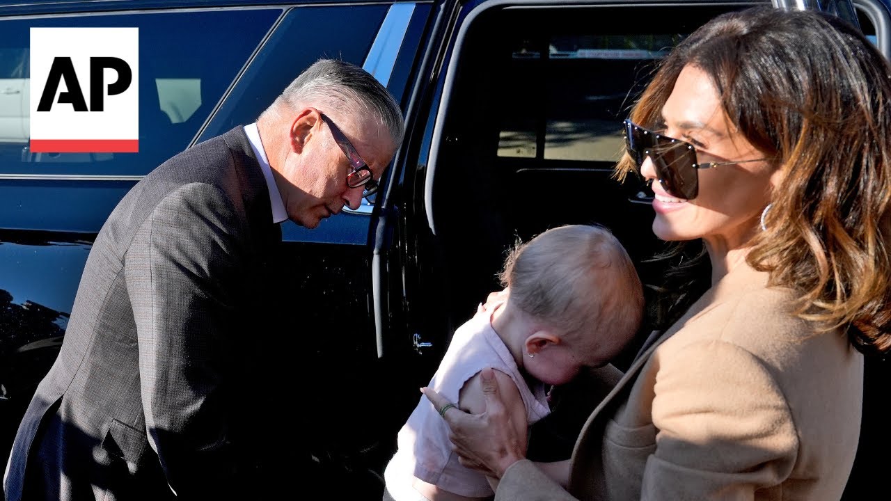 Alec Baldwin arrives at court with wife and baby