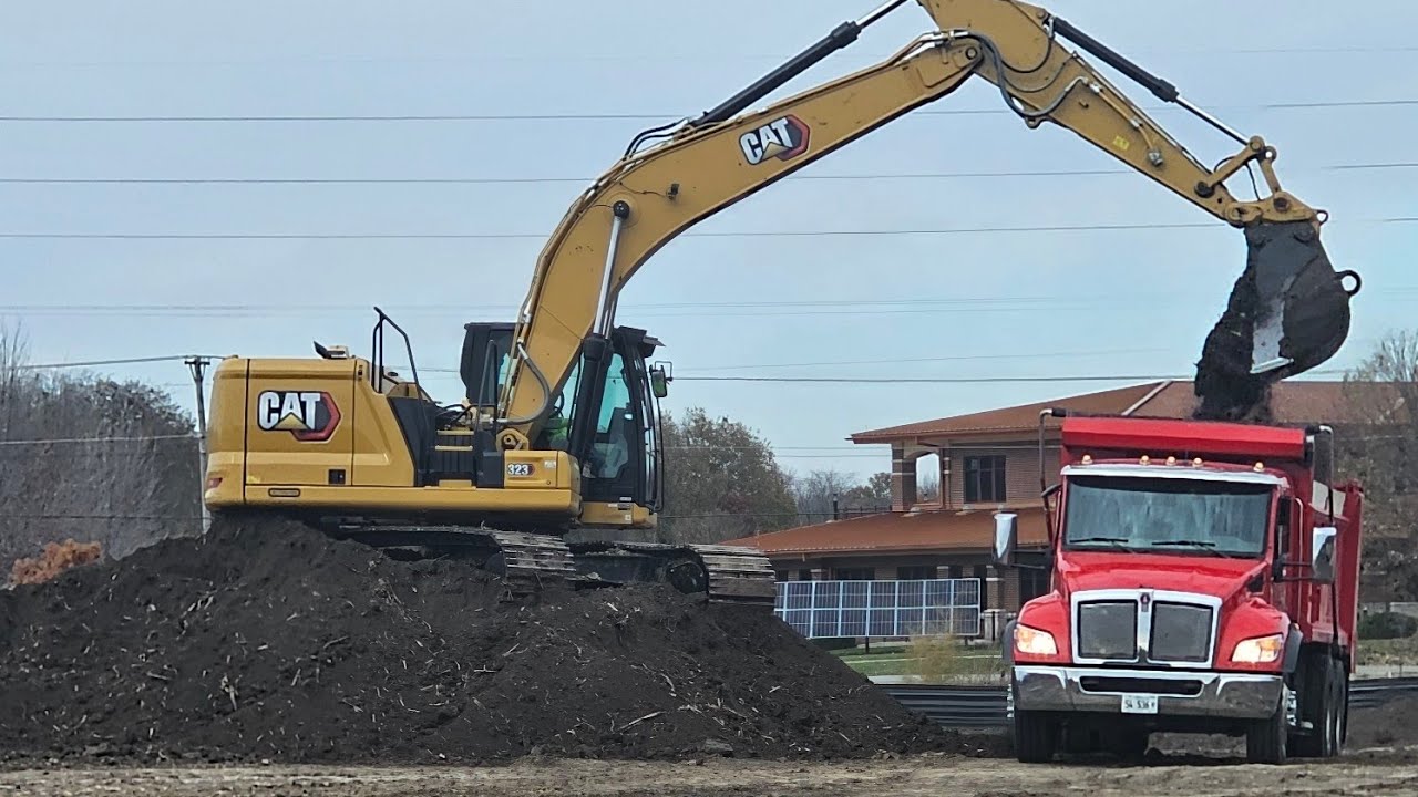 excavator loads dirt