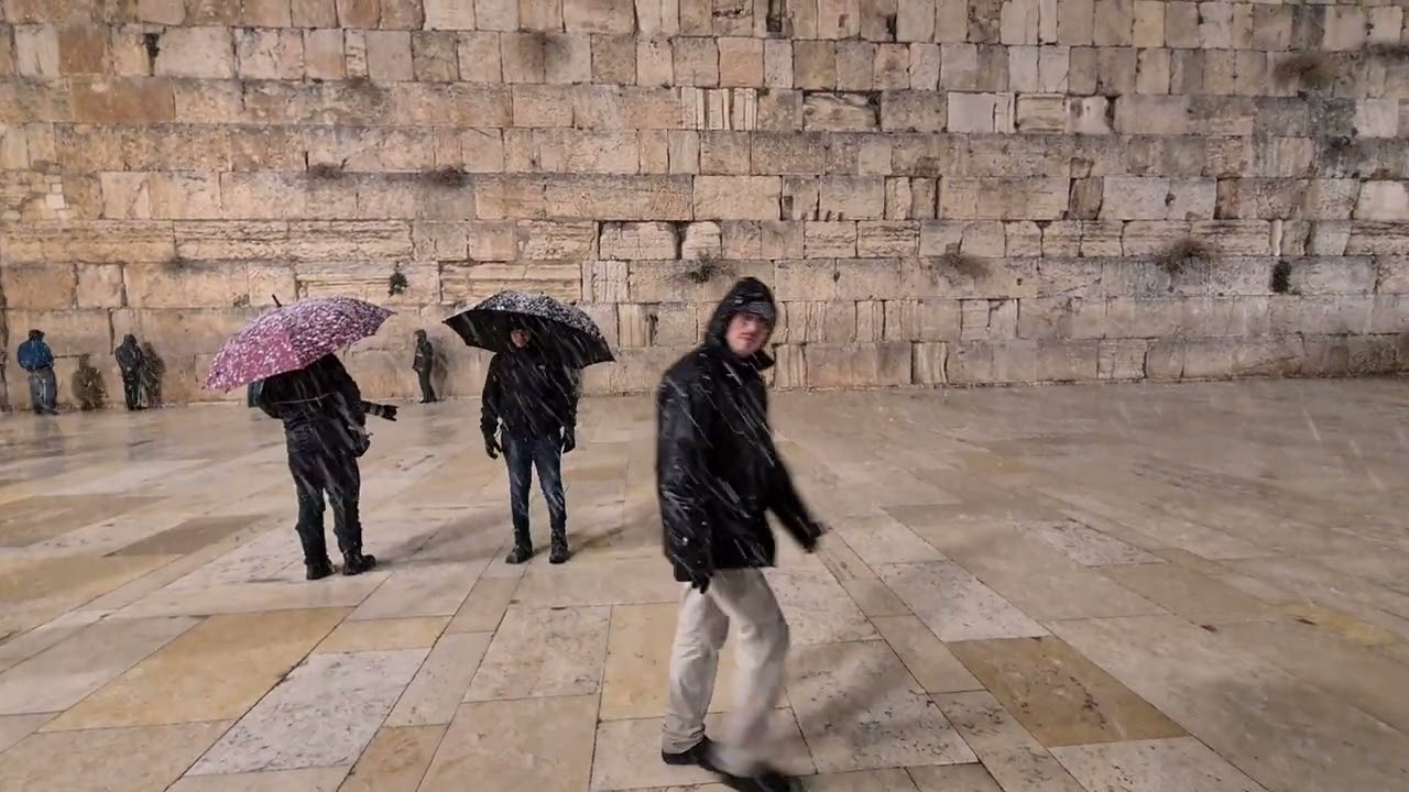 Storm Elpis: Snow falls in the  Wailing Wall  (Western Wall) Jerusalem. A pretty rare sight