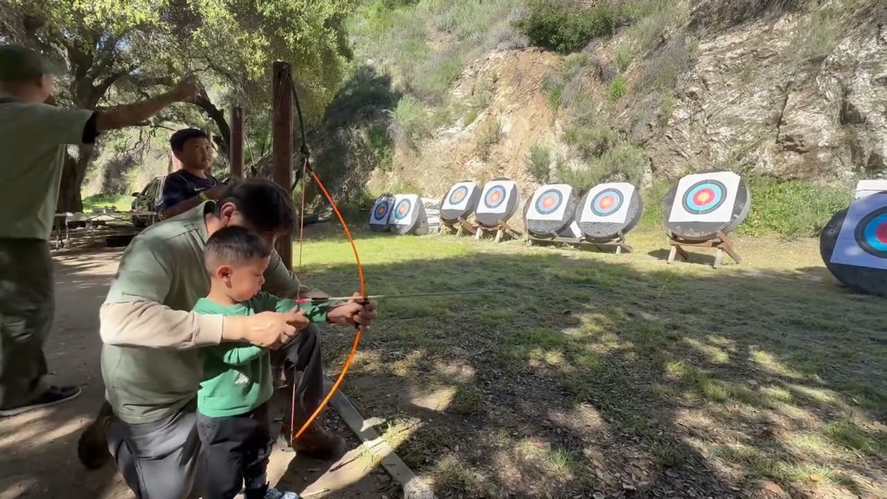 Kayden trying archery