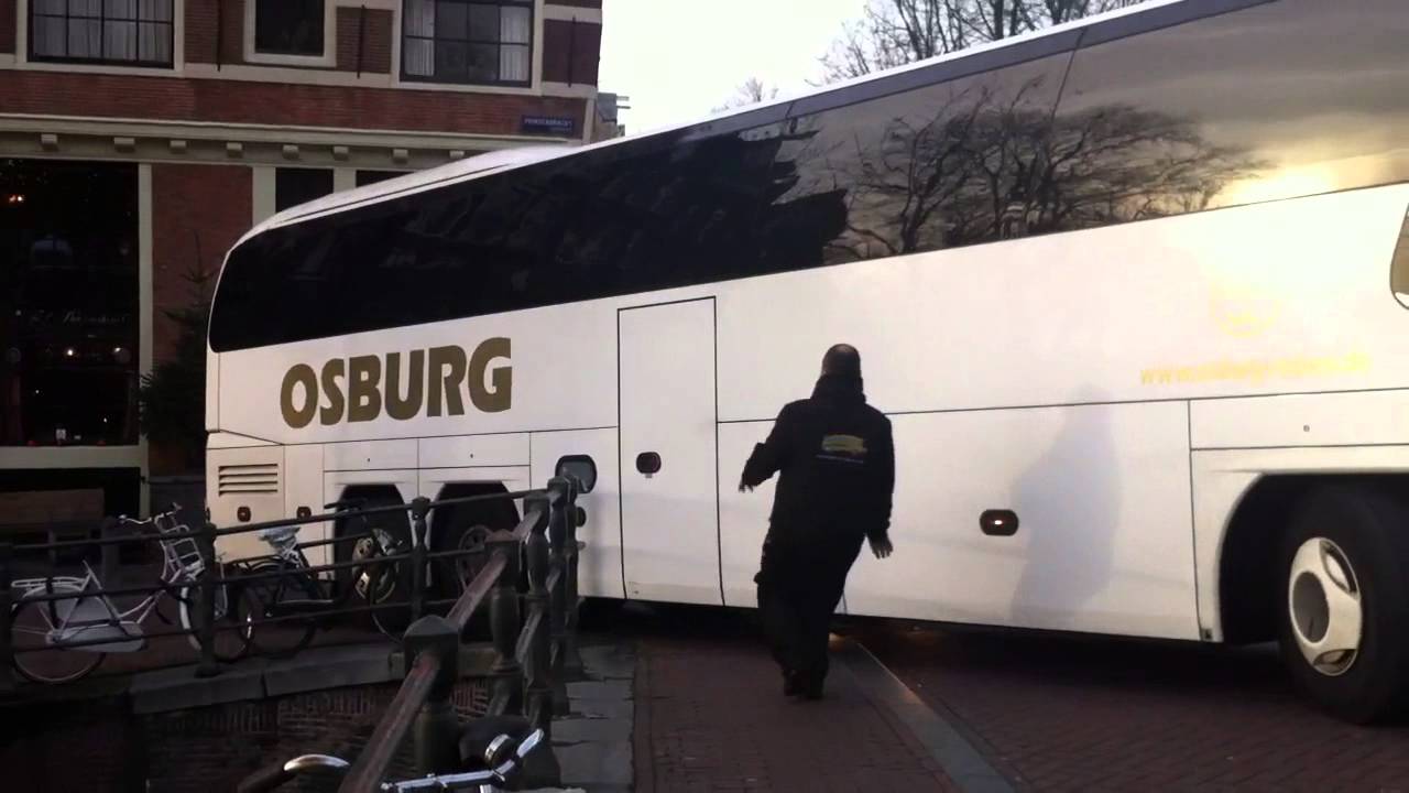 Touringcar stuck on Amsterdam canal bridge