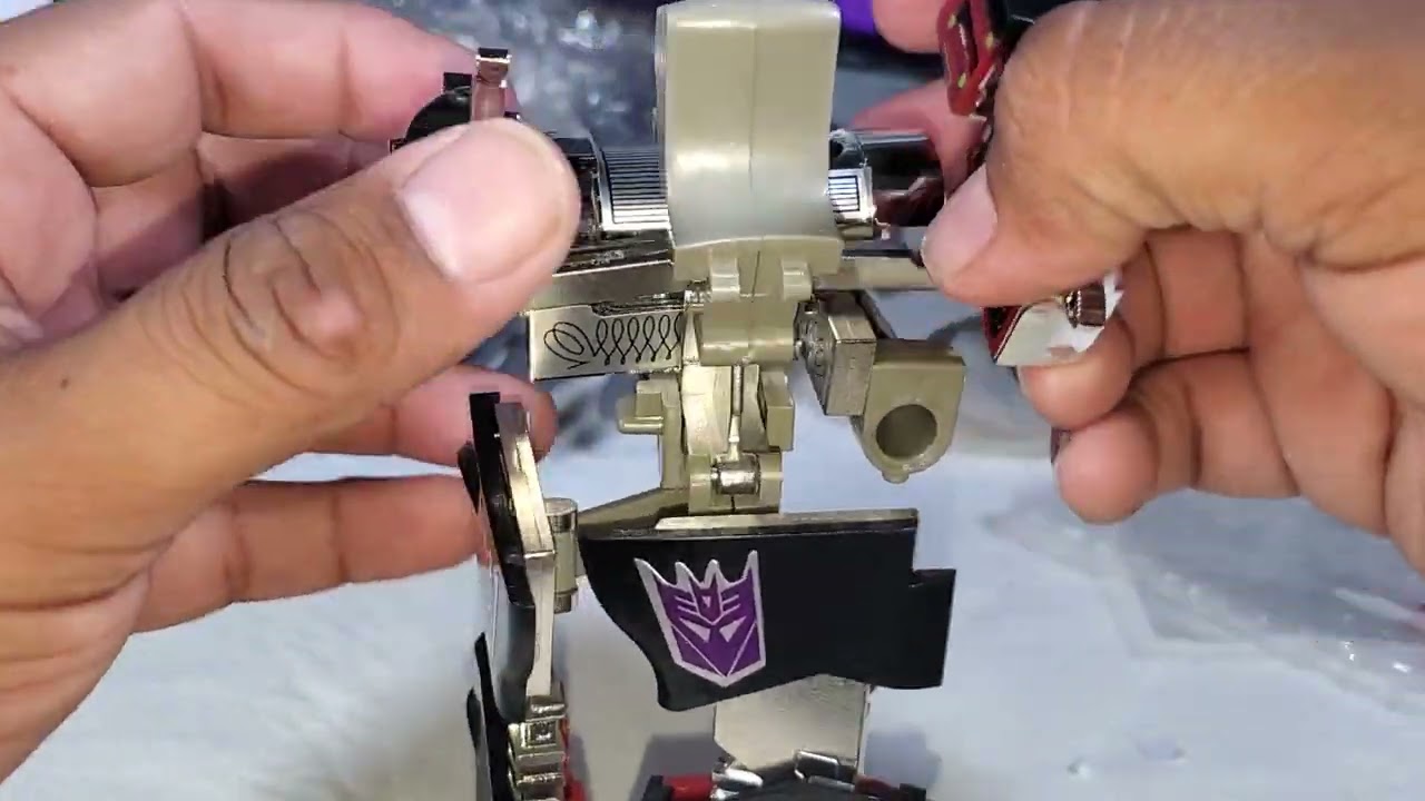 Megatron G1 toy KO arms die cast part doesn't fit between the back gap