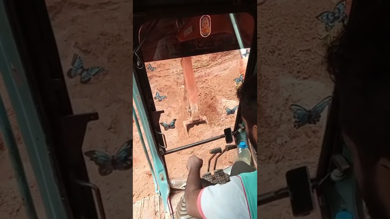 Tamil Excavator operator Hitachi landy 120 loading trucks.