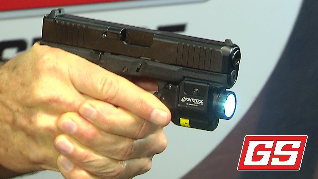 Lenny Magill shows off the Nightstick Compact Weapon Light with Green Laser.