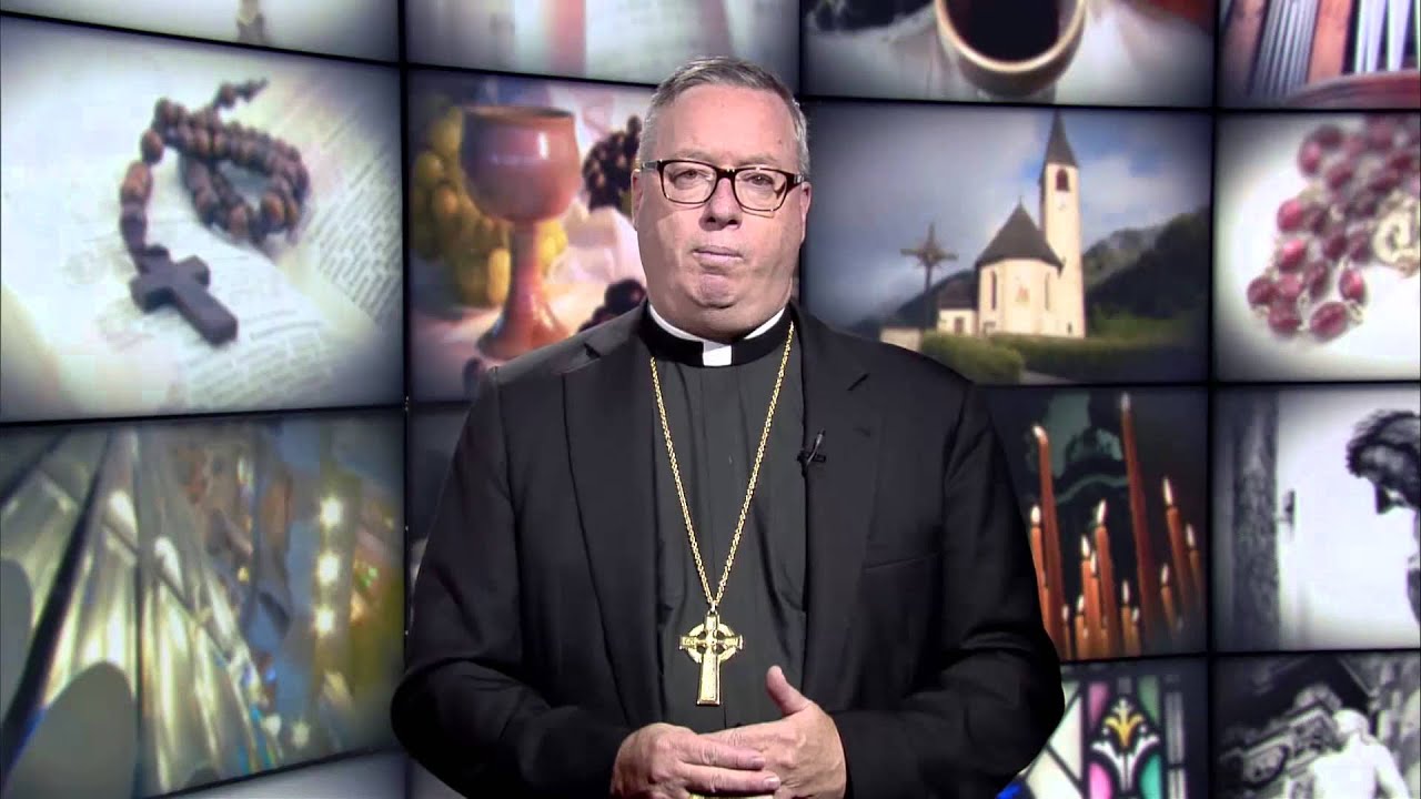 Why do lay ministers at some churches wear albs?