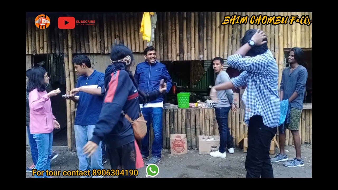 Tourists enjoying at BHIM chombu falls on the way to Lachung, North Sikkim. Local guy entertains.