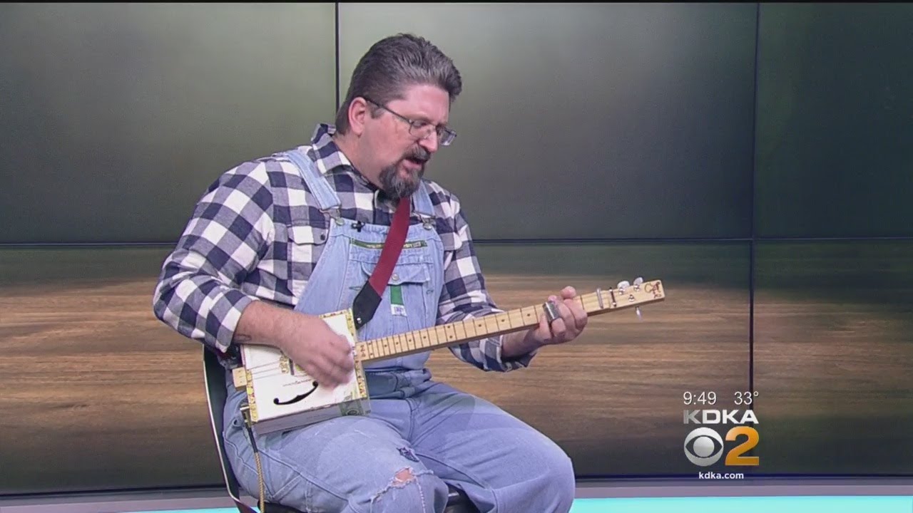 Shane Speal Performs Song Using Cigar Box Guitar