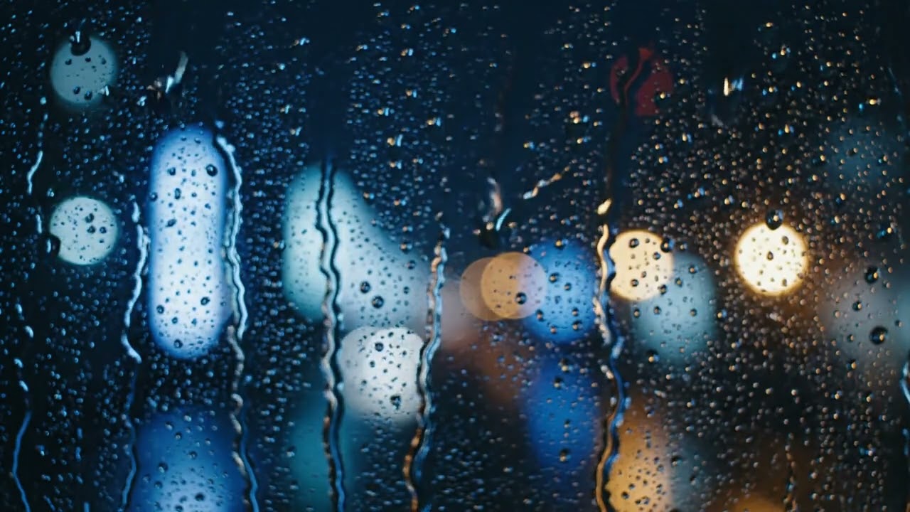 Cozy Rain on Window with City Lights