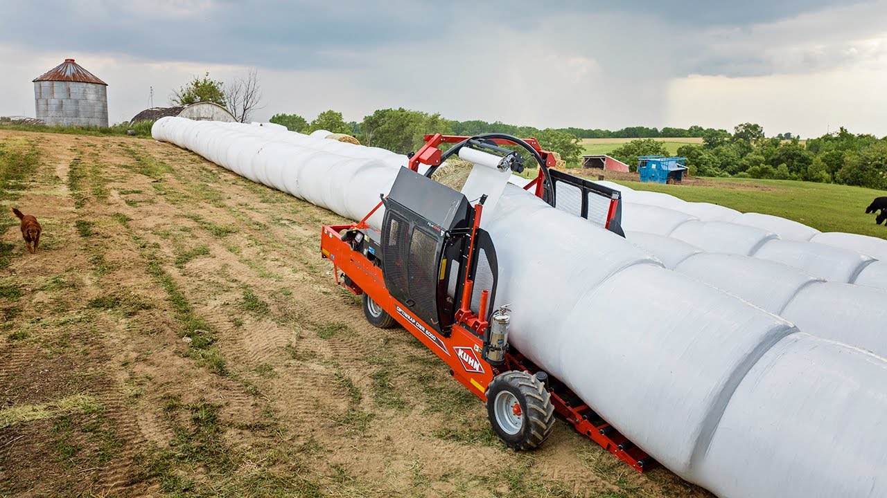 Wrapping Up A Storm - KUHN Optiwrap OWR 6000 Inline Wrapper & JCB Teleskid 3TS-8T
