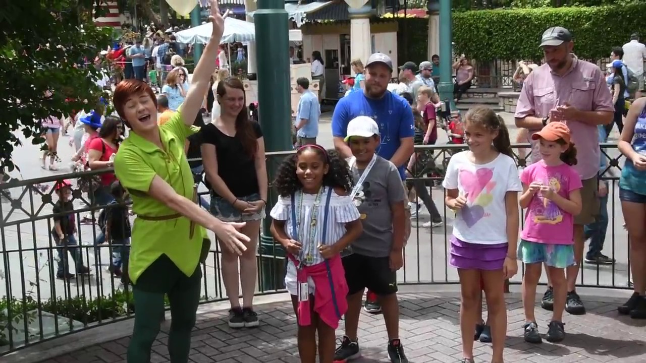 Peter Pan tells Cinderella's Story at Disneyland with friends.