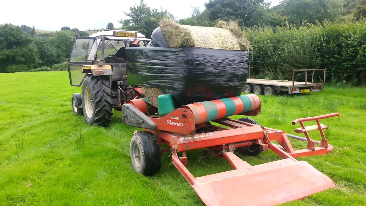 Kverneland UN7512 bale wrapper on a Marshall 702