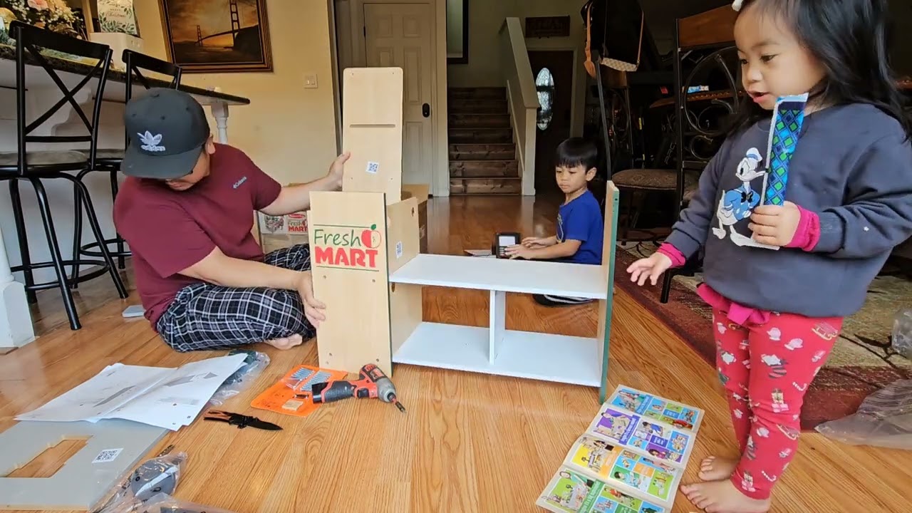 Assembling Melissa & Doug Freestanding Wooden fresh Mart Grocery Store with our Papa