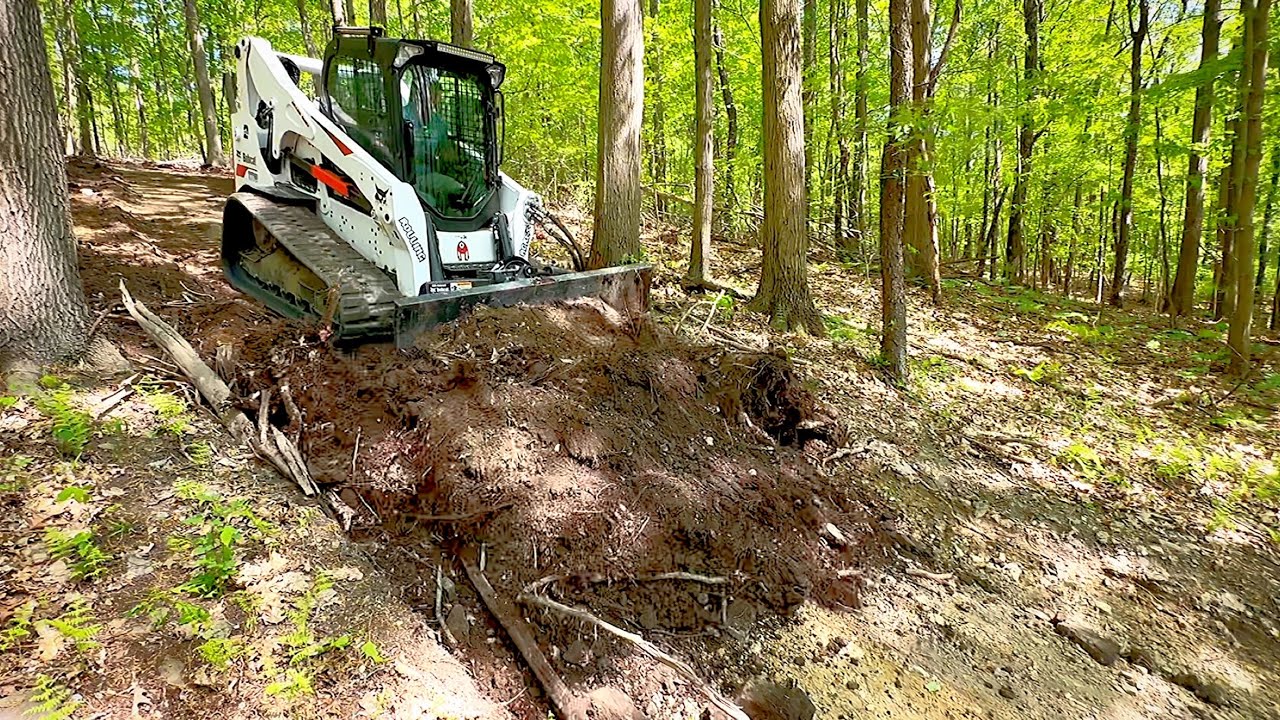 Fixing Skid Roads With A Track Loader Dozer Blade