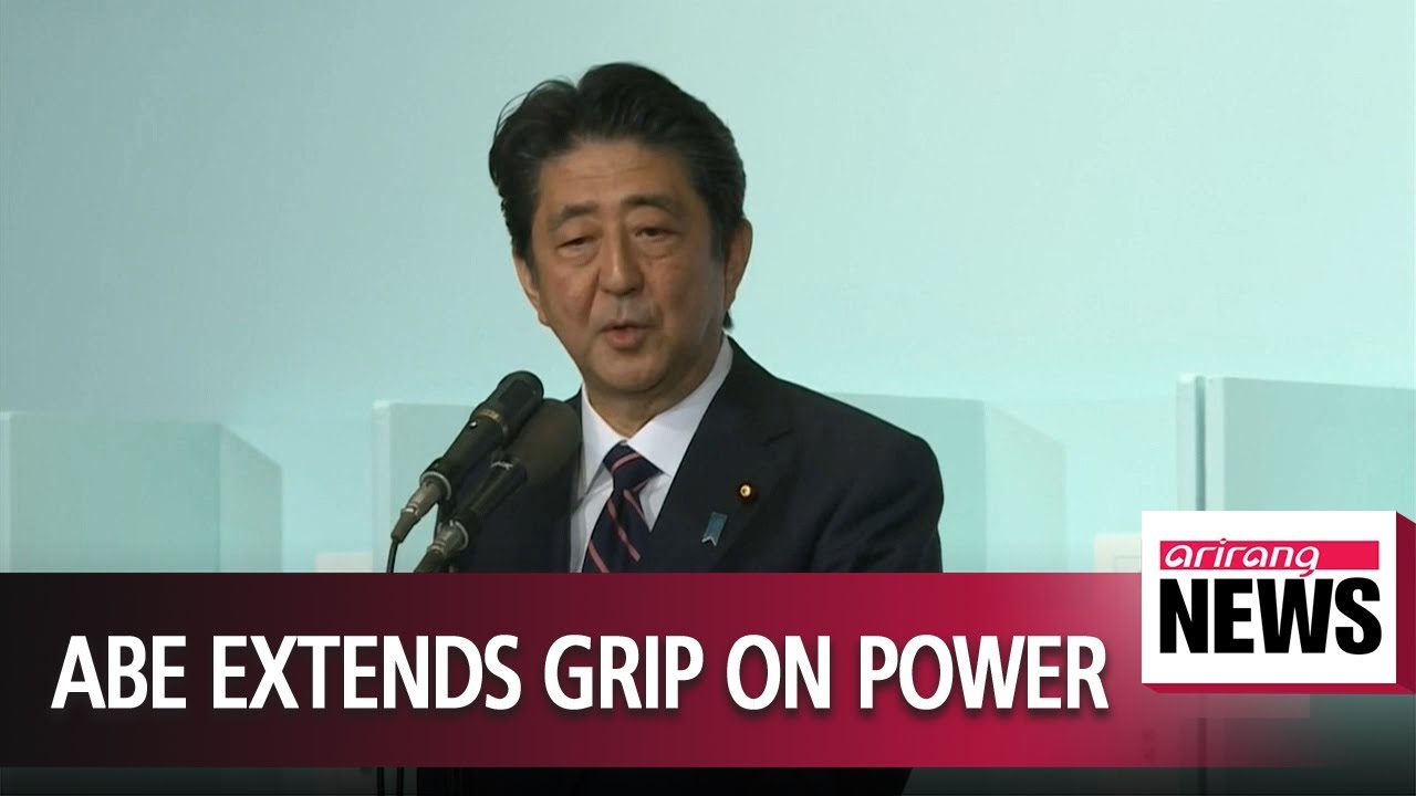 Japan's Abe re-elected as party head, to stay on as PM