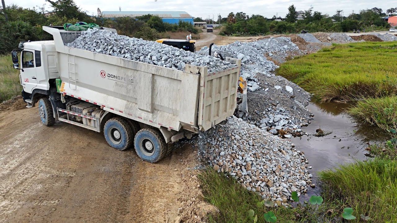 Excellent new job !! 10-wheel truck use stone fill huge region & push by Powerful dozer